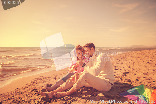 Image of young couple enjoying time together at beach