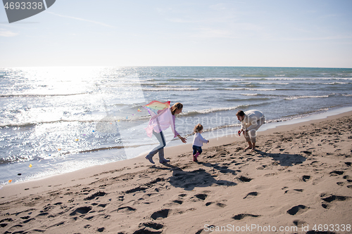 Image of happy family enjoying vecation during autumn day