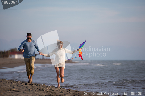 Image of Couple enjoying time together at beach