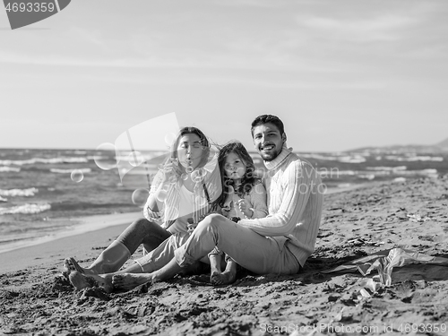 Image of Young family enjoying vecation during autumn day