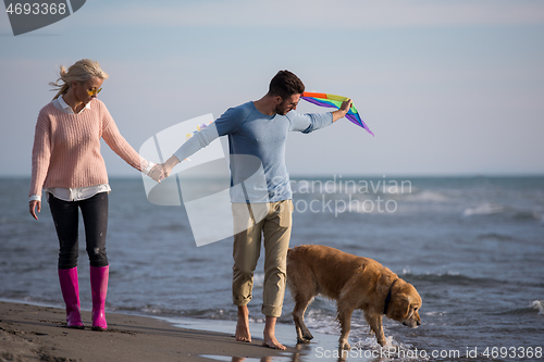 Image of happy couple enjoying time together at beach