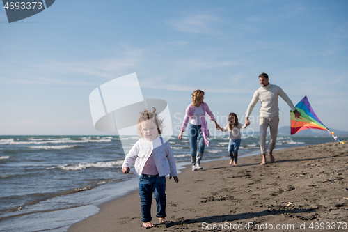 Image of happy family enjoying vecation during autumn day