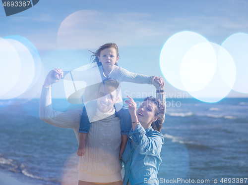 Image of Young family enjoying vecation during autumn day