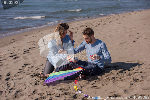 Image of Couple enjoying time together at beach