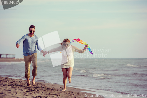 Image of Couple enjoying time together at beach