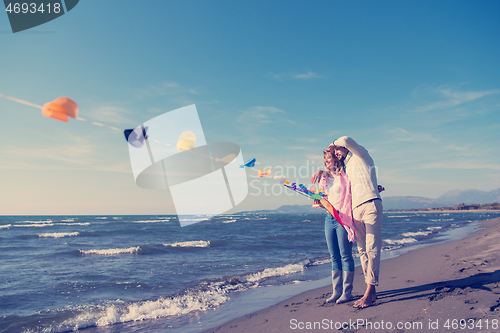 Image of Couple enjoying time together at beach