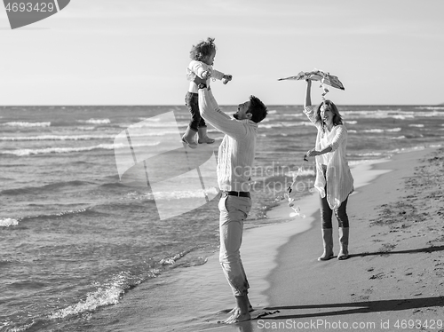 Image of happy family enjoying vecation during autumn day