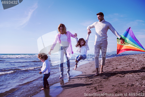 Image of happy family enjoying vecation during autumn day