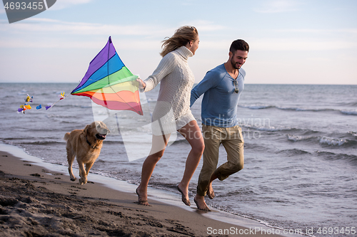 Image of happy couple enjoying time together at beach