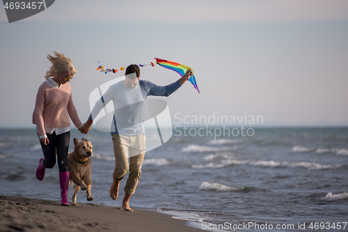 Image of happy couple enjoying time together at beach