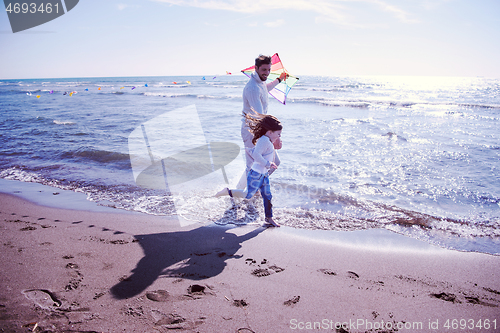 Image of happy family enjoying vecation during autumn day