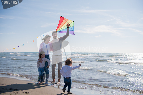 Image of happy family enjoying vecation during autumn day