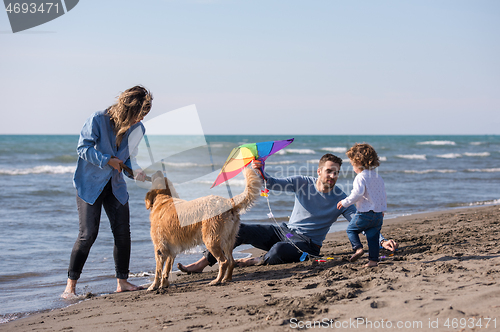 Image of happy young family enjoying vecation during autumn day