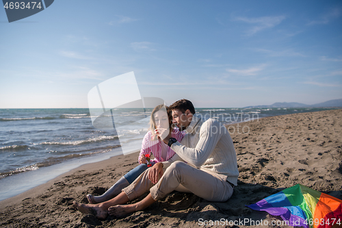 Image of young couple enjoying time together at beach