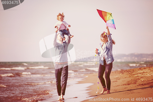 Image of happy family enjoying vecation during autumn day