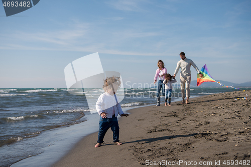 Image of happy family enjoying vecation during autumn day