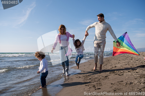 Image of happy family enjoying vecation during autumn day