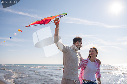 Image of Couple enjoying time together at beach