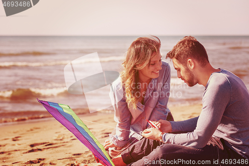 Image of Couple enjoying time together at beach