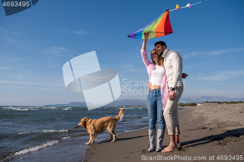 Image of happy couple enjoying time together at beach