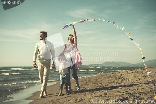 Image of happy family enjoying vecation during autumn day