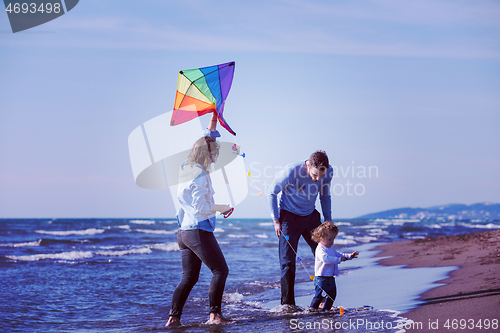Image of happy family enjoying vecation during autumn day