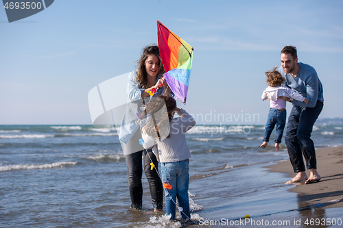 Image of happy family enjoying vecation during autumn day