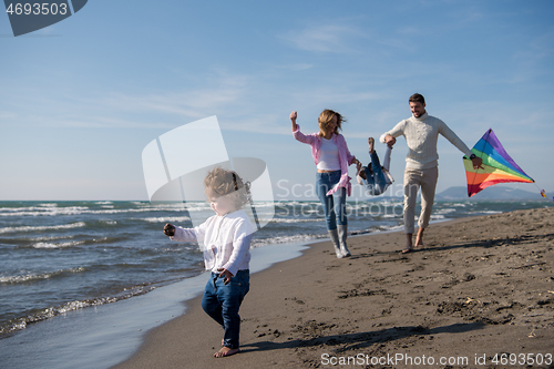 Image of happy family enjoying vecation during autumn day