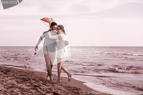 Image of Couple enjoying time together at beach