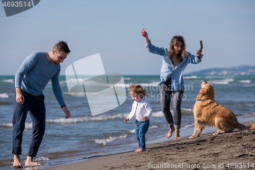 Image of happy young family enjoying vecation during autumn day