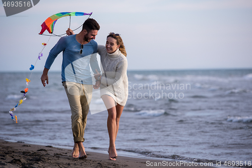 Image of Couple enjoying time together at beach