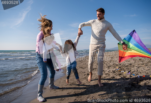 Image of happy family enjoying vecation during autumn day