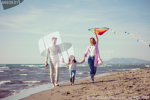 Image of happy family enjoying vecation during autumn day