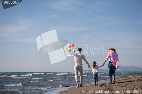 Image of happy family enjoying vecation during autumn day