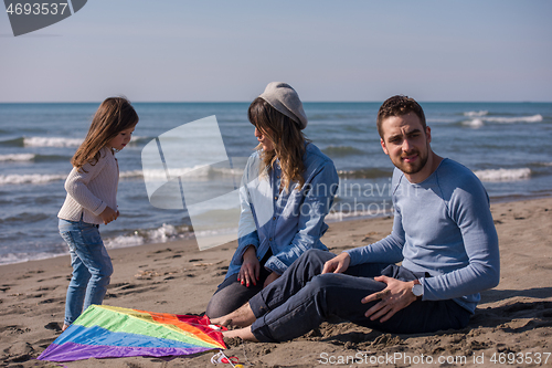 Image of happy family enjoying vecation during autumn day