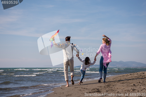 Image of happy family enjoying vecation during autumn day