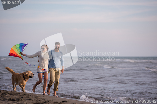 Image of happy couple enjoying time together at beach