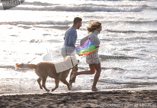 Image of happy couple enjoying time together at beach