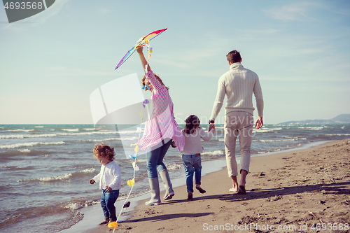 Image of happy family enjoying vecation during autumn day