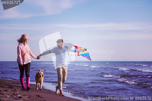 Image of happy couple enjoying time together at beach