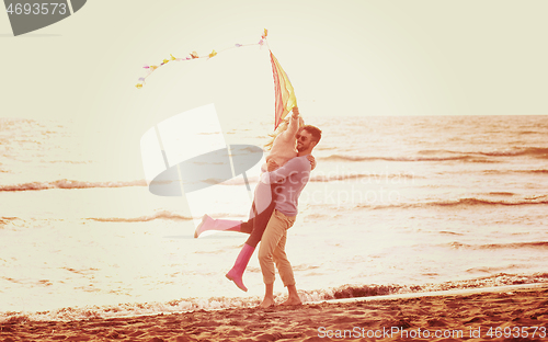 Image of Couple enjoying time together at beach