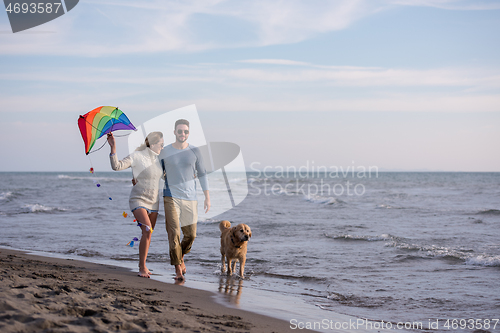 Image of happy couple enjoying time together at beach