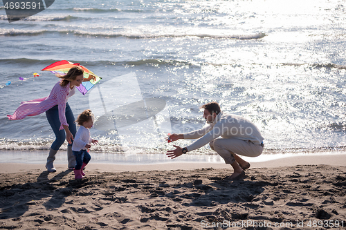 Image of happy family enjoying vecation during autumn day