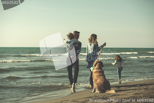 Image of happy young family enjoying vecation during autumn day