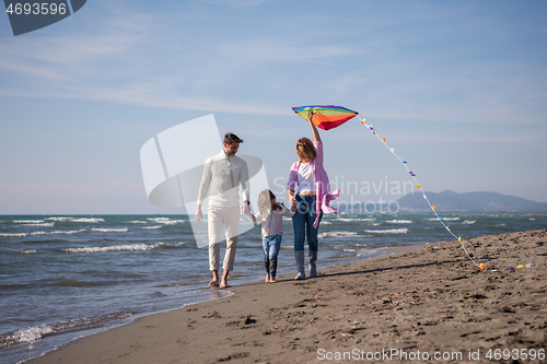 Image of happy family enjoying vecation during autumn day