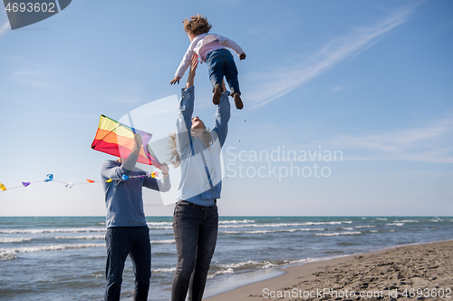 Image of happy family enjoying vecation during autumn day