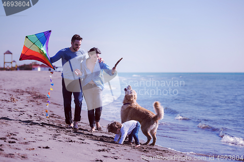 Image of happy young family enjoying vecation during autumn day