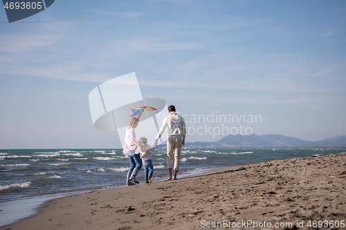 Image of happy family enjoying vecation during autumn day