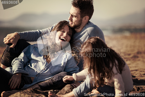 Image of Young family enjoying vecation during autumn