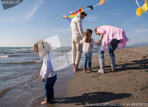 Image of happy family enjoying vecation during autumn day